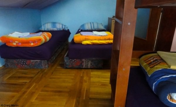 Apartment bedroom: a set of bunks and two twins.